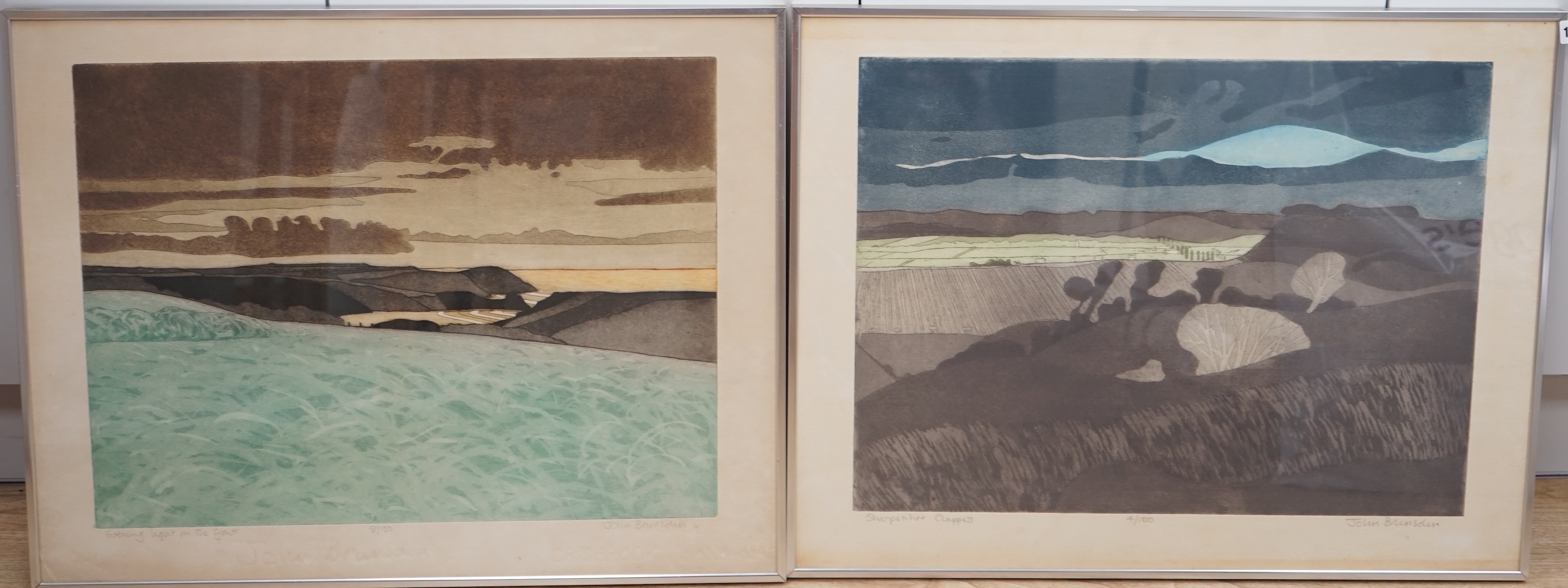 John Brunsdon (1933-2014), pair of etchings with aquatint, 'Evening light on the Gower' and one other, each limited edition, signed in pencil, 54 x 71cm. Condition - poor to fair, browning and discolouration to paper